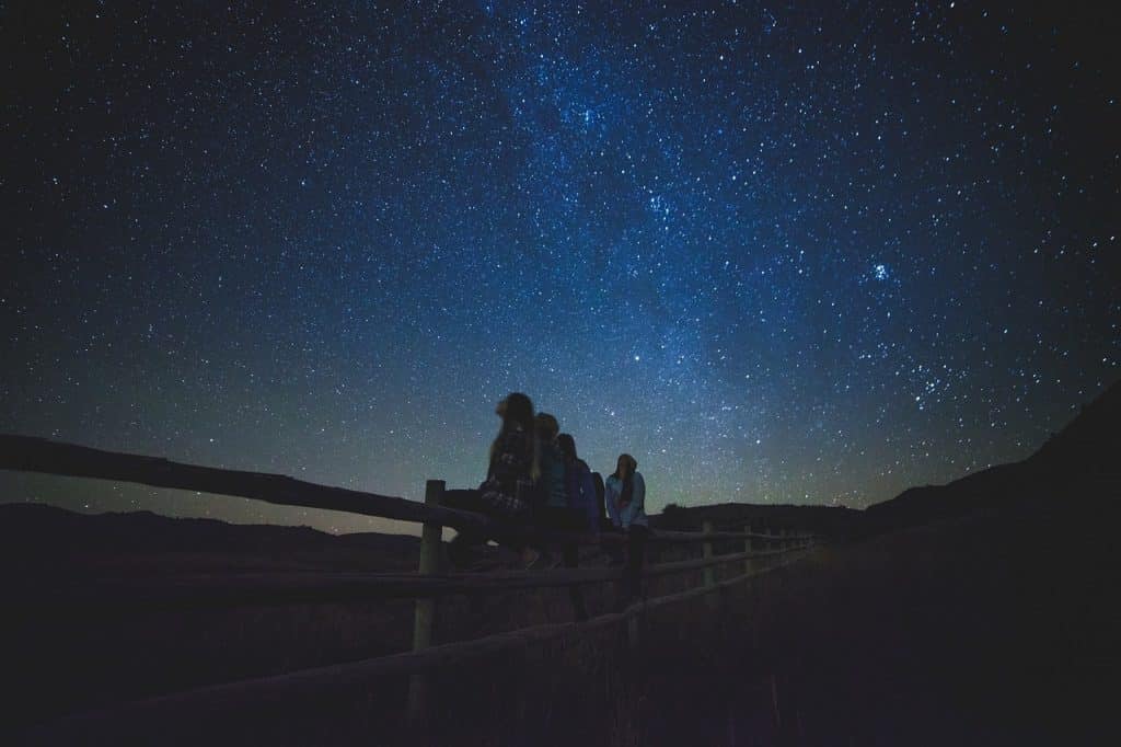 star gazing night sky while camping