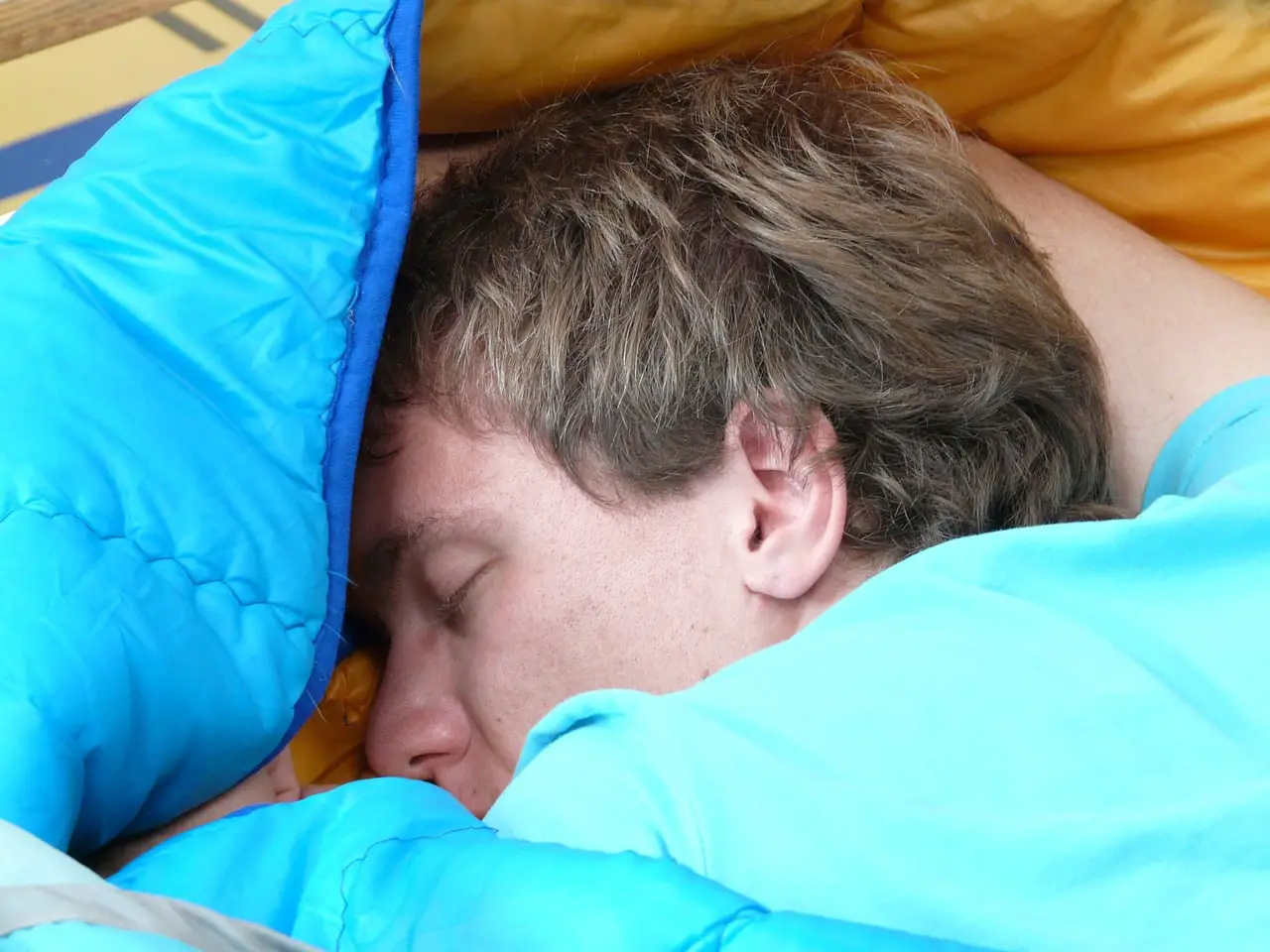 guy sleeping in a sleeping bag